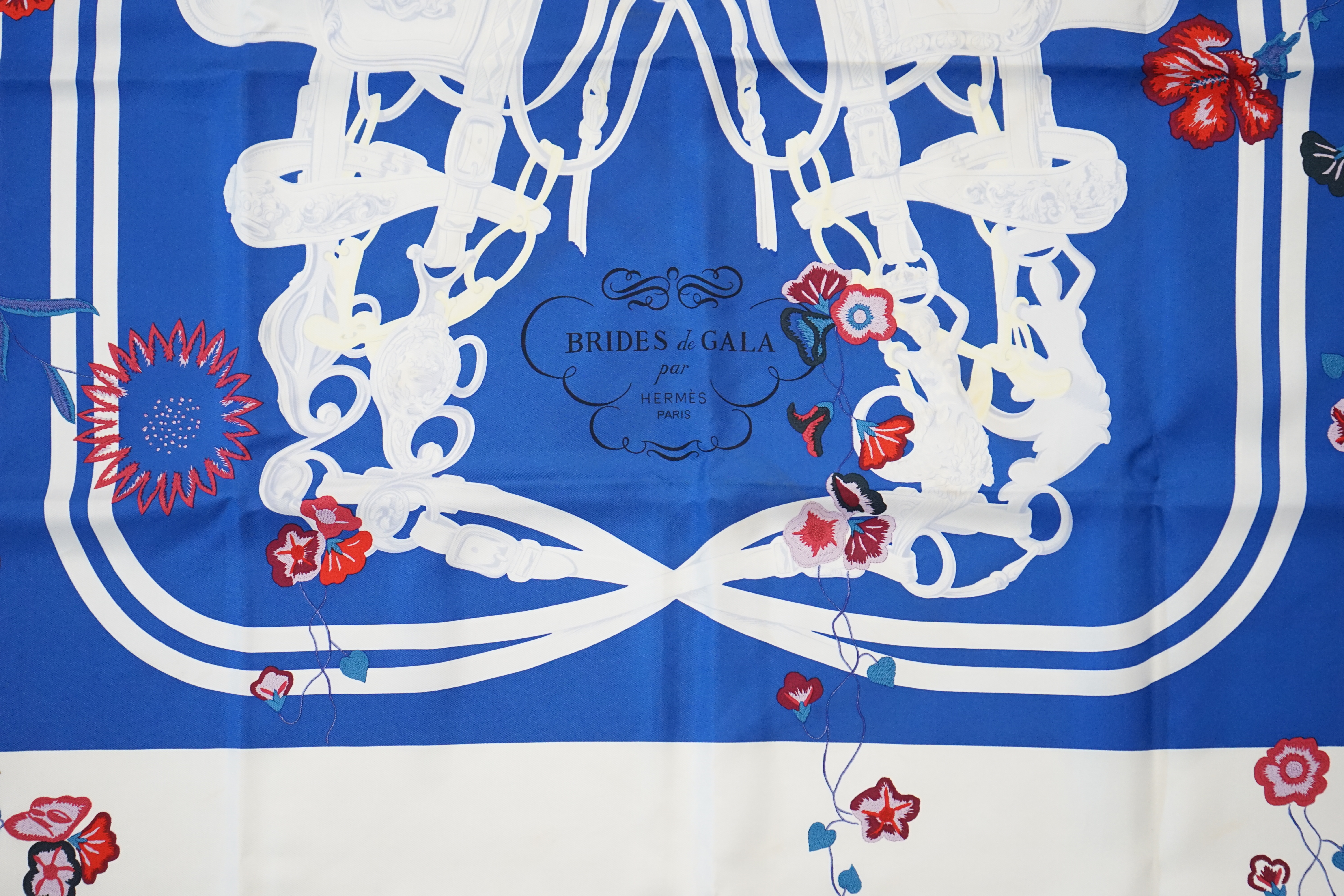 A white Hermès Brides de Gala silk scarf, approx 89cm x 88cm